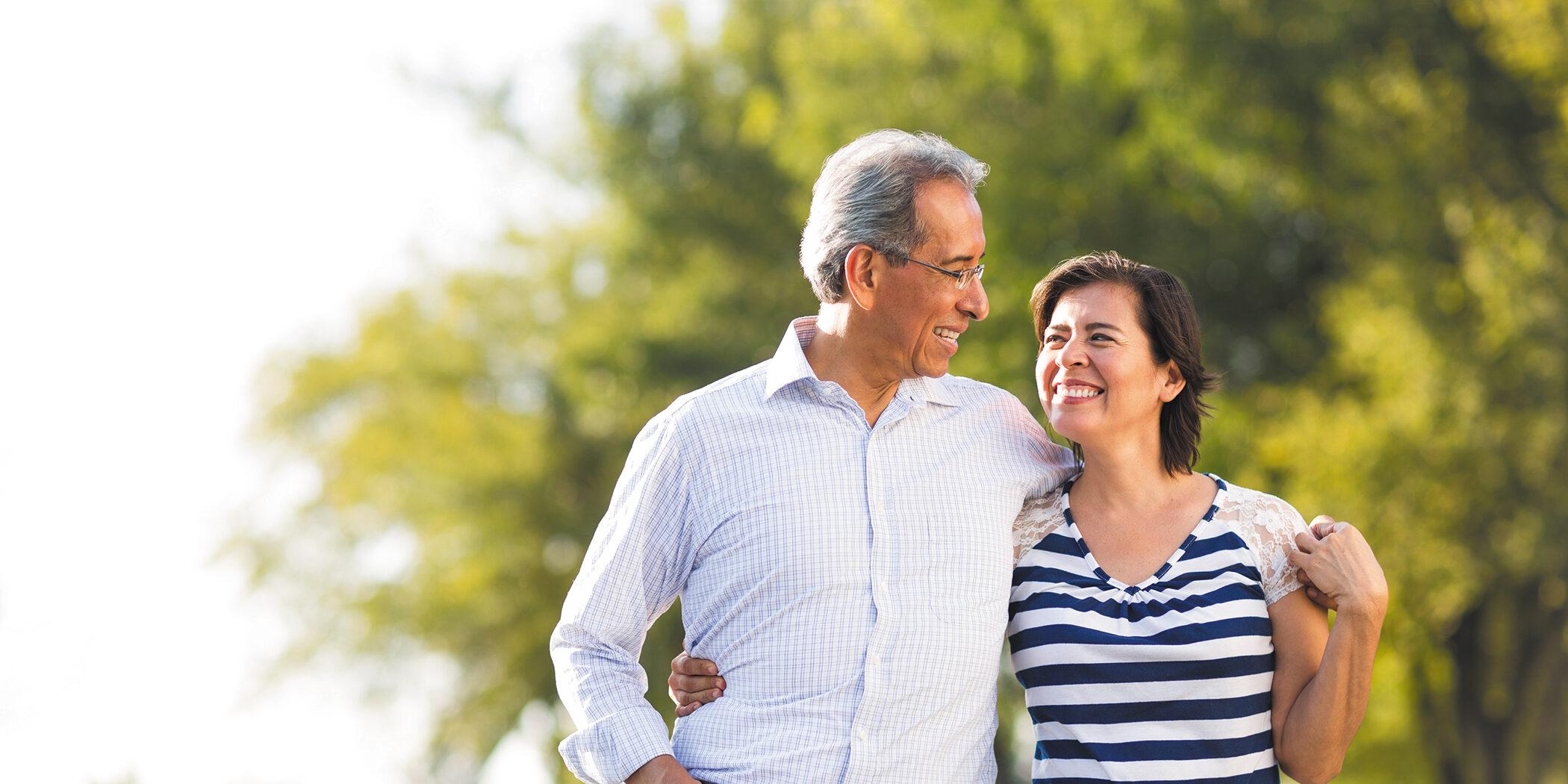 A happy older couple on a walk.