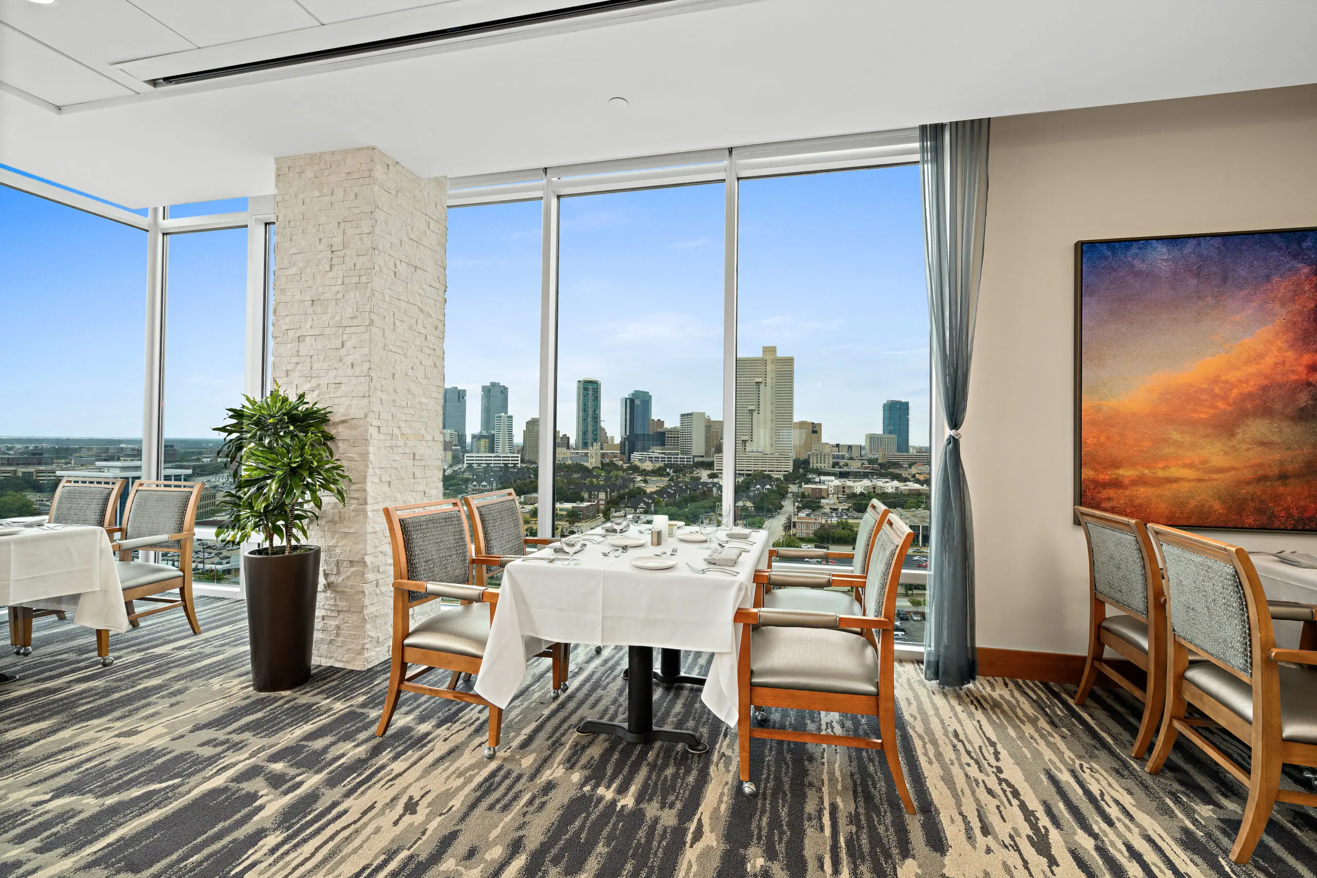 A living space with large windows at Trinity Terrace.